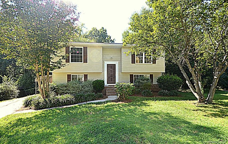 Attractive home situated in an established community. NEW carpet & vinyl, NEW roof 2014, NEW counter tops, NEW HVAC, NEW Hot water heater, &FRESH interior paint, NEW tiled full bath and vanity, FRESHLY stained two-tier deck!  Backs up to wooded area + cove location = lots of privacy! TWO storage buildings, covered side patio! Back Yard will WOW you! Details covered in this move in ready home! House Charlotte eligible! Unique in design & lots of natural light! 10 min to 485, South Park & Uptown!