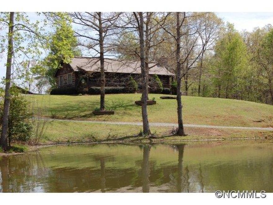 Think LakesideEscape to the country and enjoy this peaceful setting.  Fish, canoe or sit on the porch in a rocking chair. Immaculate log cabin featuring granite counters & new appliances in the kitchen, beamed ceiling & wood floor in the combined family/dining room with a stone surround gaslog fireplace, & a spacious Master suite.  Handy barn.  Very private, away from it all.  PRICED UNDER APPRAISAL!