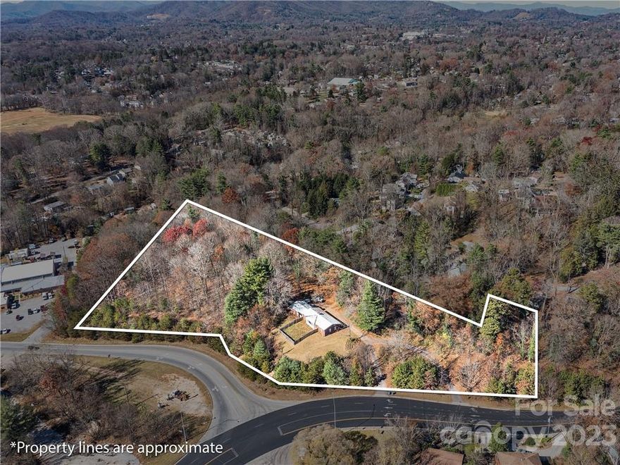 Commercial/Professional - Institutional location. 3.87 acres zoned Institutional, .90 ac. zoned RS8, for a total of 4.77 acres. Located at the corner of Shelbourne Rd and Brevard Rd. (US Hwy 191) at the intersection (Exit) of I-240 and Brevard Rd.  Two driveway cuts onto Brevard Road. There are DoT easements and drainage along ridge above Shelbourne Rd. Back portion abuts old road into W. Asheville neighborhood and entire front portion with excellent visibility from I-240 Asheville By-Pass. Strong Development potential for a variety of potential end uses. Convenient access with close proximity to I-40 and I-26. Note: Please do not disturb tenants at single family home located on property.