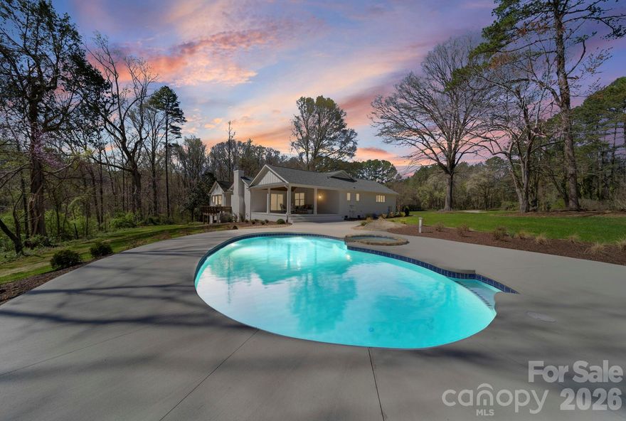 Experience unparalleled privacy and luxury in this stunning 4-bedroom, 3-bathroom brick estate, sprawling across 4.54 picturesque acres. This meticulously updated home is a masterpiece of comfort and style, anchored by a magnificent living room featuring a cozy fireplace and rustic exposed wood beams. The chef’s kitchen is a focal point of the home, equipped with premium stainless steel appliances, a functional kitchen island, and a charming breakfast nook for casual mornings.

The versatile floor plan offers both a spacious den and a dedicated recreation room, providing ample space for work, play, or relaxation. Step into the sunroom to enjoy year-round views of your private acreage, or head outside to the massive open wood deck that overlooks your backyard paradise. The inground pool is the centerpiece of summer fun, complete with a dedicated pool house for easy entertaining. For the hobbyist or professional, the property includes a substantial detached garage/workshop. Whether you’re exploring your own woods or hosting a poolside gala, this updated brick sanctuary offers a lifestyle without compromise.