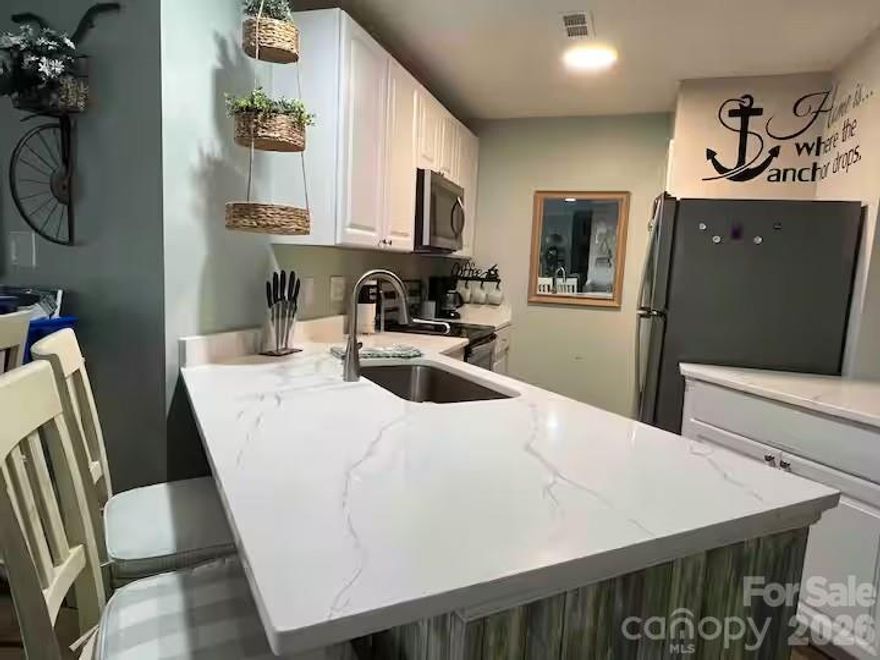 Balance of assessment will be paid by the seller at closing, with an acceptable offer.  Enjoy the best of Lake Norman living in this beautiful 2-bedroom, 2-bath condo! This inviting home features an open-concept layout that seamlessly connects the living, dining, and kitchen areas—perfect for relaxing or entertaining. Natural light fills the space, creating a warm and welcoming atmosphere throughout.

Step outside and take advantage of the community’s exceptional amenities, including tennis and pickleball courts, a refreshing pool, and scenic walking trails. Whether you’re enjoying an active lifestyle or simply soaking in the peaceful surroundings, this community offers something for everyone.

Located near the shores of Lake Norman, you’ll love the convenience of lakeside living with easy access to outdoor recreation, dining, and local attractions. Don’t miss the opportunity to make this charming condo your next home!
Seller will sell furnished if interested. Seller will pay assessments until the end of 2026. New roof, siding, balconies resurfaced, new banisters, landscaping. Pool is being resurfaced, new deck and furniture.