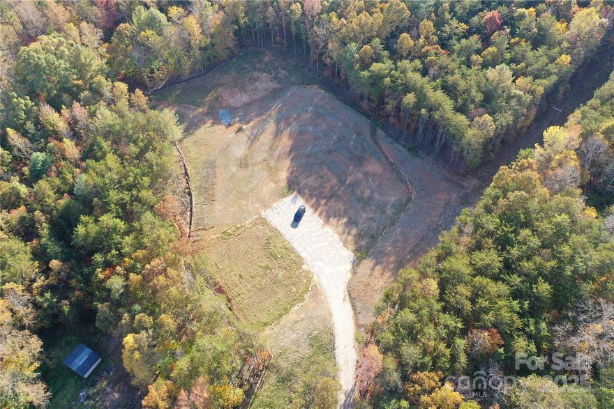 Ready to start your dream home, here is 4.72 acres to do that on.  Majority of the work has been completed on this property.  It has been cleared, graded, drainage, gravel driveway, and 5 bedroom septic.  It is surrounded by trees for privacy.  This is a must see.  Close to I-40.  (Possibility of connecting to city of Morganton sewer with a civil engineering plan. Possibility of city water.  These need to be verified.)