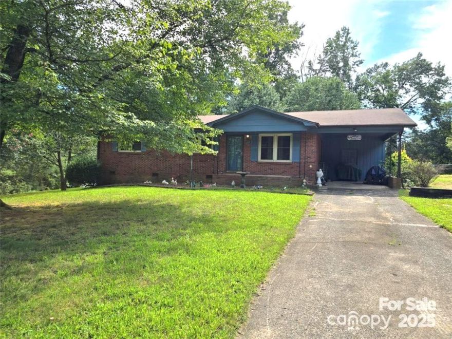 Sitting on a level, corner lot just under half an acre, this solid 3BR/1.5BA brick home offers easy, single-level living in a great location. Enjoy an open kitchen and dining area designed for comfortable gatherings. The attached one-car carport adds convenience, and the nearby utility room includes laundry. Two outbuildings convey, perfect for storage and hobbies. Located close to schools, downtown Morganton, and countless hiking trails. Oak Hill, Table Rock, and Freedom school district. No HOA fees.