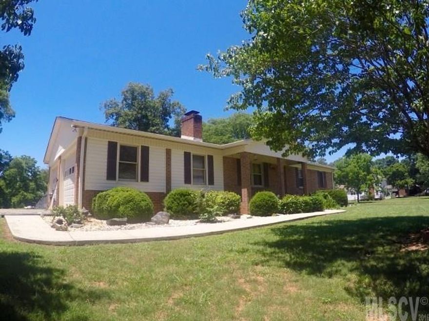 Spacious 3 bedroom, 3 bathroom home for sale, conveniently situated on 1.38 acres in Newton! Complete with blackberry bushes, strawberries, peach trees, and pecan trees! This home affords an oversized, double car garage, 1025 sqft fenced area in the back yard, 125 sqft out building, and 20'x4' front porch. Inside, on the main level, you'll find a large kitchen complete with breakfast nook and vinyl flooring, living room with gas log fireplace (propane) and laminate flooring, hallway closet has working laundry chute. Dining room/office opens to the living room. Master bedroom w/private 3/4 bath, secondary bedroom and common bathroom. The walk-out basement offers large laundry area, huge bedroom with french doors and wood burning fireplace, full bath and exercise room w/access to the back patio (437 sqft).