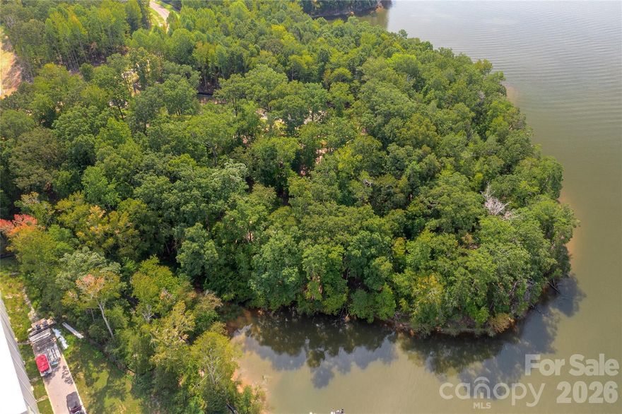 Premier waterfront community on Lake Wylie in Belmont NC. Homesite 348 features a dockable homesite with 0.76 acres of space to build a home. Located on a short cul-de-sac street, this is a serene location. Homesite 348 can accommodate a boat dock with your permit from Duke Lake Management at the time you build your home. McLean features exceptional approved builders who can bring your desired home design to life on this beautiful homesite. Once you purchase the homesite, there is no time limit in which you are required to start building a home, so the timing is flexible to your needs! McLean is located in an amazing spot that is quiet, yet so close to so much! Love small town living and casual downtown vibe when you visit the quaint town of Belmont NC - only about a 10-minute drive from McLean. Enjoy Stowe Park in the center of Belmont, or  coffee at Everyday Market, watch the train go by, play/jog/lounge at the park while listening to the fountain on sunny days, or meet friends for dinner at any of the great restaurants in town. Take in all that Uptown Charlotte has to offer in restaurants, theater, sports, and other events - just 30 minutes away. Travel far and wide for work or play - the Charlotte Douglas international airport is only 20 minutes away and you don't even have to get on the highway - YAY! Premier waterfront living is featured at McLean South Shore, the preeminent community within McLean. Let's walk this homesite!