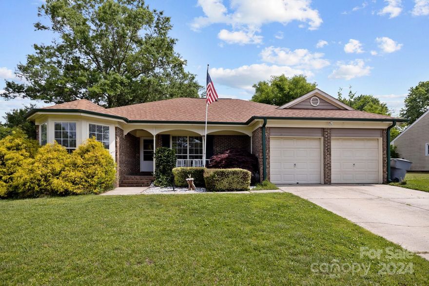 Welcome home to this charming ranch situated on a LARGE corner lot! With 3 bedrooms and 2 full bathrooms, this well-maintained home offers comfort and convenience. The primary bedroom has an ensuite bathroom with a spacious shower, double vanity, and 2 closets. Enjoy cooking in the beautiful eat-in kitchen, relax by the cozy wood-burning fireplace in the open living room, or unwind on the peaceful screened porch. The laundry room leads to the 2 car garage which has a shop and utility sink. Located just off Idlewild, this location provides easy access to Highway 74, with shopping and restaurants close by. Come tour this inviting property and see all it has to offer you!
