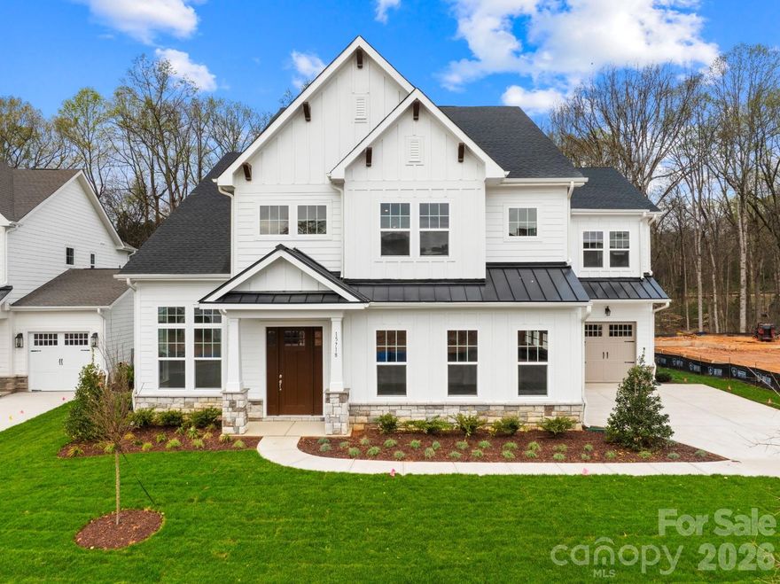 BRAND NEW & NEVER OCCUPIED. This stunning 5-bed, 5.5-bath residence offers designer-appointed living in prestigious Coventry Glen. The main level features 8-ft doors, a private office with 12-ft ceilings and transom windows, and a gourmet chef's kitchen with upgraded quartz, professional range hood, and custom oak paneling. Extended breakfast area with boxy bay window and morning sunroom. Main level guest suite with full ensuite bath plus powder room for guests.
True indoor-outdoor living: 12-ft stackable multi-slide doors open the great room — with gas fireplace — to a covered patio, screened porch, and an exceptionally large private backyard backed by a wooded buffer. Rare in this community and ideal for a future pool.
Upper level: Vaulted primary suite with serene wooded views, spa bath, soaking tub, tile shower, and separate his-and-her wardrobes. Three secondary bedrooms each with private ensuite and walk-in closet. Large pre-wired media room.
3-car split garage, solid oak open-rail staircase, tile in all showers, pre-wired security. Under 3 miles to Historic Downtown Davidson, minutes to Birkdale Village and I-77.