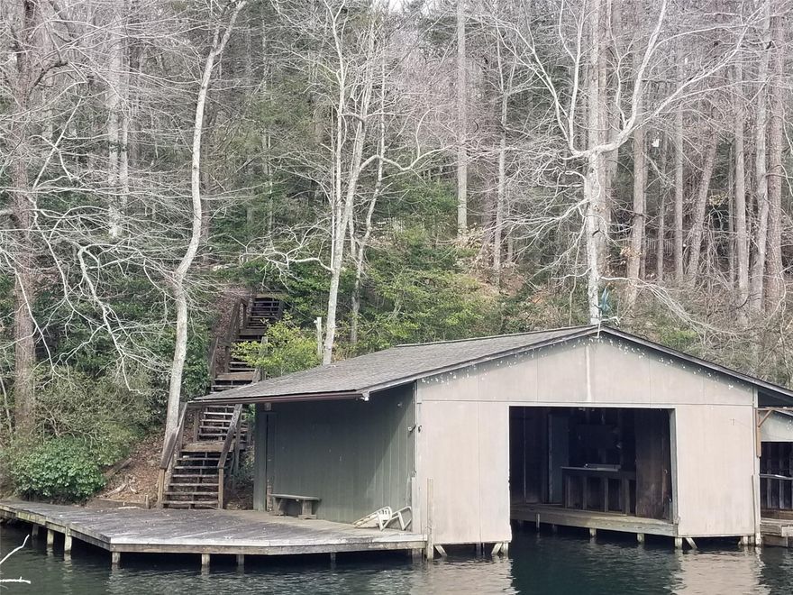 Sportsman's dream! Quaint 3BR/2BA-LAKE TAHOMA cottage built as a hunting & fishing lodge less than 1 hr from Asheville. Privately held development (only 51 owners sharing ownership of +/- 3200 ac of forests, +/- 6 miles of trout stream, +/- 180 ac. lake, sporting clays area, pavilion, hiking, boating, hunt turkey and deer, all at the foot of Mt. Mitchell. Boathouse  10 min. from shops & dining in historic Marion. 20 mins from I-40.