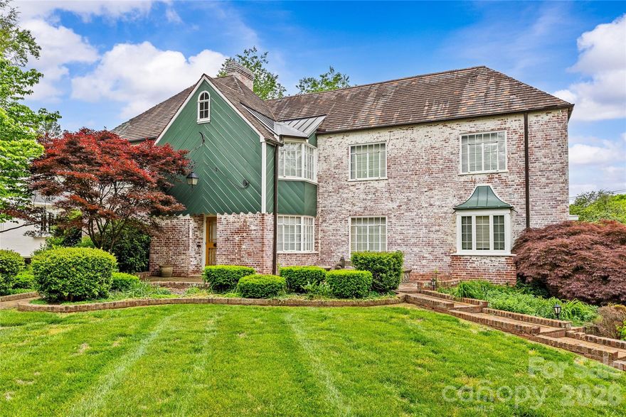 Exceptional opportunity on iconic Queens Road West in the heart of highly sought-after Myers Park. Set on a beautiful, .46-acre lot, this property offers a rare chance to renovate or build new in one of Charlotte’s most desirable locations. The existing full brick home offers approximately 3,585 square feet and features a large walk-out basement that is partially finished and fully-framed, adding an additional 1,300+ sq/ft of area already under HVAC with updating and renovation potential. Combined with the attached 3+1/2 car garage, the current home provides a strong foundation for a complete transformation. The lot is truly special—lush, mature landscaping creates a private, garden-like setting rarely found at this scale. Enjoy living just moments from Freedom Park, nearby greenways, and the shops and dining along Selwyn Avenue, with a short commute to both SouthPark and Uptown. Whether reimagining the current home or building a custom residence, this is a premier opportunity in a coveted location. **Please note home is being sold in AS-IS condition**