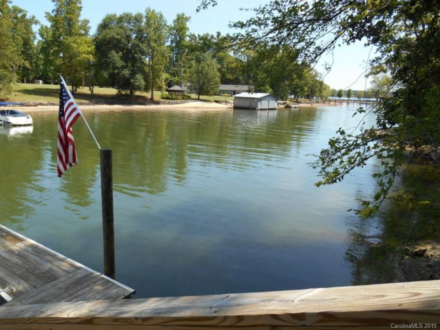 Gorgeous custom built waterfront home! Deep water cove! Floating dock. Open concept home w/waterviews from almost every room. Full walk-out unfinished basement. High ceilings. Huge master bath w/heated floors. Kitchen w/custom cabinetry, large breakfast area & keeping room w/fireplace overlooking the lake. Great room with stone fireplace. Screen porch & deck. Oversized 3 car garage w/2nd access to basement. Basement plumbed for bath & kitchen. 2 instant hot water heaters.