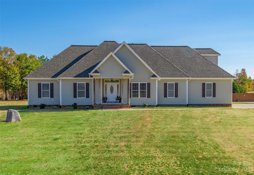 Prepare to be impressed with this beauty! Shows like a model with lots of details, great layout with open floorplan. No detail left undone! Beautiful granite kitchen with stainless appliances, and tons of cabinets and storage space. Living room flows to the kitchen for easy conversation. All one level living with flex room above garage. Primary suite is so pretty with trey ceiling features double vanity with granite counters. Wood floors throughout with tile in the baths.  Great deck that looks out over the 1 acre lot.