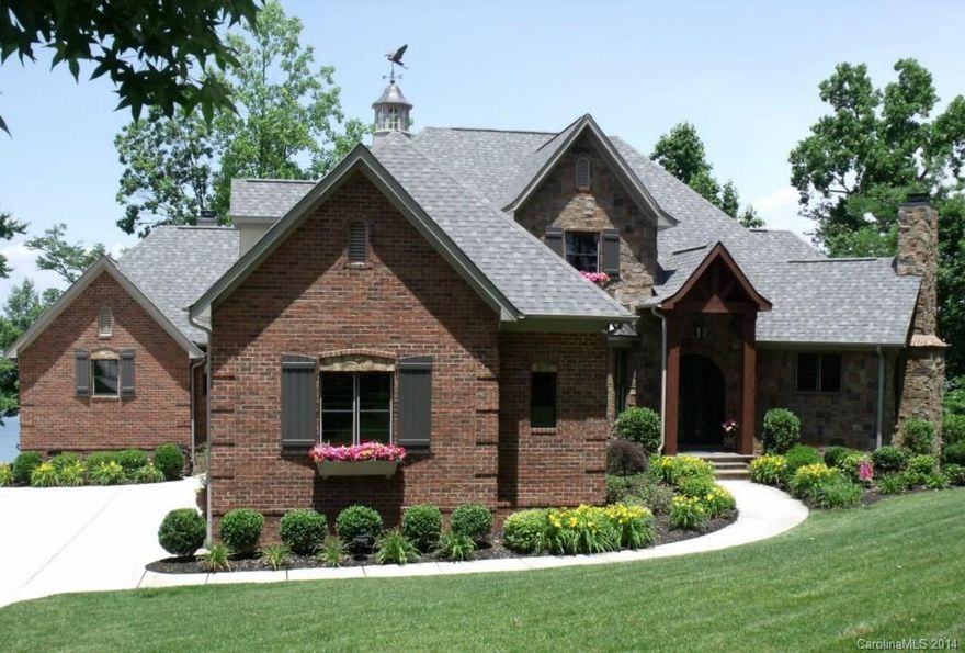 Gorgeous home with all the bells and whistles.  Main Channel view from almost every room. Spacious custom kitchen w Exotic Granite, Copper Farm Sink & High End Appliances.  3 Ovens, Bread Warmer, Wine Cooler & More.  Main level spacious master suite & secondary main level bedroom.  Nice screened porch w cozy FP & expansive views. Sandy beach, Outdoor Kitchen.  Priced below tax & appraised values.