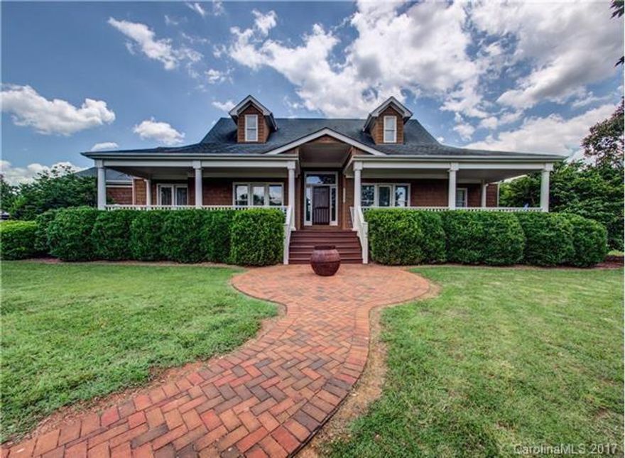 Custom 3bed/2bath home on 4ac. w/large rocking chair front porch & back deck, cedar siding. All bedrooms have porch access! Family room w/stone fireplace opens to kitchen w/ new granite & SS appliances. Locust hardwood floors. Land can be subdivided (2 lots total) No HOA or restrictions! 4 separate pastures w/1 stall horse barn. Water & sewer available. Fenced garden area, fire pit, deck, sheds, fresh ext. paint, & outdoor speakers. Tranquil retreat in central Huntersville. LOCATION, LOCATION!