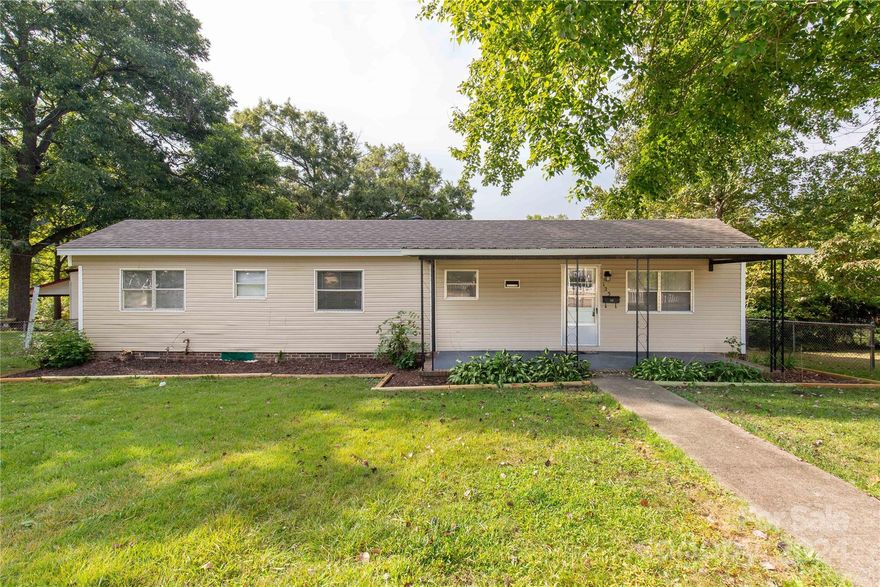 Adorable single wide on brick foundation with addition on .30 of an acre lot in Clover. Covered front porch. Open floorplan with spacious dining room, kitchen, walk-in laundry room, bath & 1 bedroom in original home then step down into the living room with exposed beams, columns and masonary raised hearth fireplace and 2nd bedroom. Chain linked fenced in backyard with storage building and lean to. Immaculate and ready for move-in. Fenced in backyard with storage building.  Close to downtown, parks, school, restaurants and shopping. A must see!