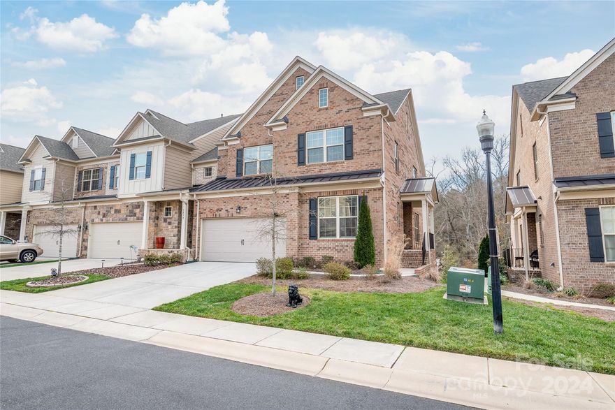 WOW! This end unit, full brick townhome WITH a basement in Bridgemill has SO much to offer. Walkability? YES! Walk to the new shopping area in front of the neighborhood for dinner and wine, ice cream, the butcher! In addition to all of the amenities that Bridgemill has to offer! This townhome lives like a large home, yet no yard work and very little maintenance! This home iis practically brand new with one single owner and no pets! The home offers all of the luxuries that most desire, granite countertops in the kitchen & all baths, white cabinetry, SS appliances, gas stove and low maintenance, yet beautiful wide plank LVP flooring throughout main floor. The open concept allows for easy entertaining! There are two owner suites, one on the main level and one upstairs. Heading upstairs, there's a loft and two, very large guest suites! The walkout basement features a huge entertaining/bonus room area. There's also an unfinished room (16x14) and it is also plumbed for additional full bath!