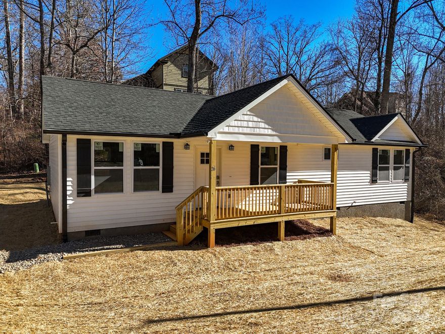 Excellent location minutes to everything in West Asheville and less than 10 minutes to Downtown. Quaint location just nestled back enough for some privacy. Open floor plan bathed in natural light is perfect for entertaining. Roomy primary bedroom boasts an extra large walk-in closet and elegant primary bath with dual vanity and custom tile shower. Luxury vinyl plank flooring, fabulous kitchen with stainless steel appliances, granite counters, spacious all plywood soft close cabinets, under cabinet lighting, and the perfect kitchen island. Neutral colors make decorating a breeze. Front porch is a spectacular place to enjoy that clean mountain air. Well-priced and waiting to hold all of your fond memories or become your next charming retreat or sought after investment property. Finished interior pictures are shown as an example. Tax value based on previous vacant land and does not represent current improvements.