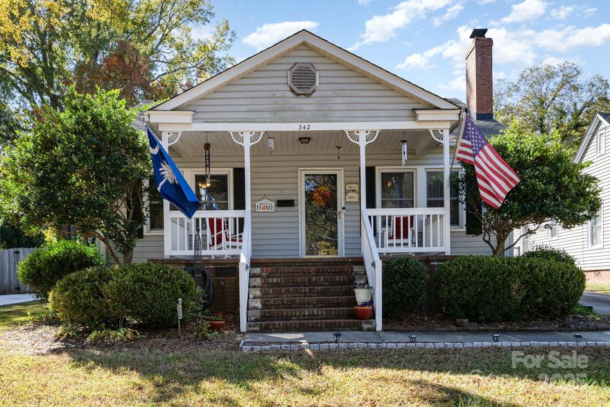 Discover downtown Rock Hill living at its finest. This 3-bed, 2-bath gem blends timeless charm with the updates buyers expect today. A brand-new roof installed in 2024 means peace of mind from day one, and the open-concept layout makes everyday living and entertaining simple and comfortable.

Step inside to find hardwood floors flowing throughout the main living areas, adding warmth and character. The kitchen is a true highlight—quartz countertops, modern finishes, and plenty of prep space make it easy to cook, host, or just enjoy a quiet morning coffee. Natural light fills the home, giving every room an inviting feel.

The primary suite offers a private retreat, while two additional bedrooms provide flexibility for guests, a home office, crafting room, or whatever life requires.  The home’s classic feel has smart updates where they count.

Outside, this property really separates itself. The fenced backyard and usable space—ideal for pets, gatherings, or quiet evenings. A pergola sets the tone for outdoor dining or relaxing in the shade, and the fire pit area is perfect for crisp Carolina evenings. Need storage or a hobby space? The wired workshop shed gives you room to work, create, or organize without compromise.

This isn’t just a house—it’s a lifestyle. Short distance to downtown Rock Hill’s Fountain Park, restaurants, shops, breweries, and community events. Enjoy the energy of growth happening around you while settling into a neighborhood rooted in history and community.

If you’re looking for character, updates, and location without sacrificing practicality, this home delivers. See it for yourself—homes like this don’t wait around.