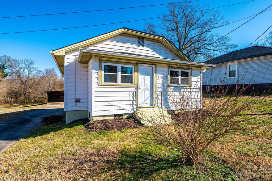 BEAUTIFULLY REMODELED 2BR/1BA in LINCOLNTON, NC is a great value! Vinyl siding, a brand NEW roof & NEW windows are just the beginning...ALL NEW LVT floors; subway tile backsplash; tile surround; vanity; hardware; light fixtures; plumbing fixtures; mirror; kitchen cabinets; granite countertops and so much more! This house has a great layout too with a true foyer; large living room/dining with built-ins & a pass thru window looking into the kitchen; 2 bedrooms both with WICs; a true laundry room and full bathroom! Tall crawl space with concrete floor; detached car shed & concrete driveway. Conveniently located near Lincolnton Parks & Rec; Betty G Ross Park & Motz Ave Dog Park!