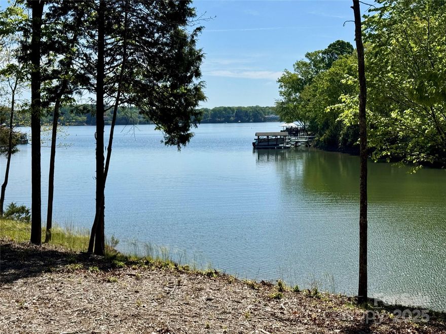 RARE opportunity to build your waterfront dream home on this pristine 5.25 acre lot with over 357ft of water frontage on Lake Wylie!! Located just off the main channel with DEEP water, this is the perfect place to call home. The lot is mostly level with a gentle slope towards the water, and there are several wonderful places to position a home to take advantage of the stunning lake views. The seller has obtained dock permit approval and a septic permit for a 5 bedroom home. All of the surrounding lots are 5 acres or greater, so you will have complete privacy and plenty of space. The community is less than 10 miles from Lake Wylie or Rock Hill, and only 25 miles from the Charlotte Airport. NO HOA, no CCR's and no restrictions. Clover Schools, low Lake Wylie Taxes and zoned for the new Lake Wylie High School opening fall of 2026!! Also listed as a proposed home with MLS# 4337937.