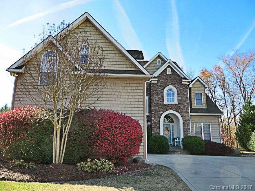 Sitting pretty in the cul-de-sac! Customized home plan  features vaulted 2 story Great Rm w/floor to ceiling side to side 72" windows w/transoms, gourmet Kitchen w/glazed 42" maple cabinets,ss appl. incl. new Bosch dishwasher & deluxe main level Master Suite. Formal DR/Office w/french doors. Extensive moldings. Upstairs has huge game rm, 2 BRs w/Jack & Jill bath, catwalk to 4th BR. New Roof 2011. New 3rd zone HVAC 2015. Rinnai tankless water heater. Double deck overlooks level, treed backyard.