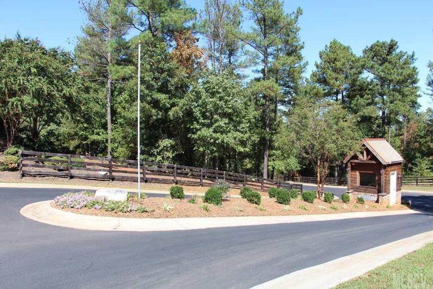 Excellent Building lot #212 in private gated subdivision. Lakefront community on Lake Rhodhiss, this lot has combined road frontage of approx. 500 ft.