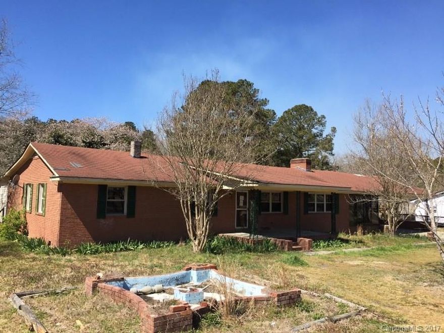 Brick ranch with three bedrooms and two baths.  Huge family room with fireplace.  Large screened porch and double carport.  This one is a diamond in the rough needing some TLC.  This is a bank inventory home that can only be purchased by owner occupants through May 2.