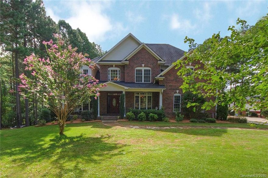 Your private haven on Lake Wylie! 5-bedroom brick WATERFRONT on 2.06 acres, lots of wooded area.  Covered dock w/ shady seating area & boat lift, short cove opening to the Big Allison channel, a terrific area for boating and watersports. Spectacular updated kitchen with premium granite, beautiful Hickory hardwoods throughout home. Dramatic 2-story stone fireplace in great room.  Loft w/ sitting room on upper level, plus lower level rec room w/ fireplace. Unfinished workshop/storage in basement.