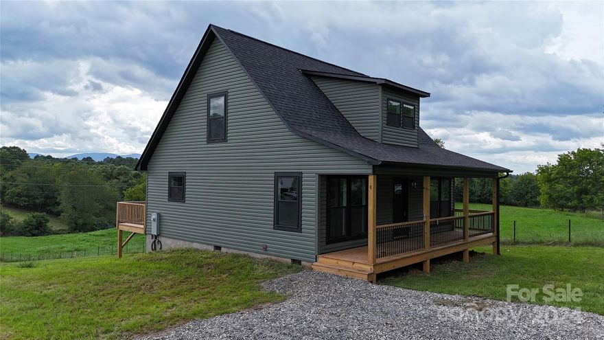Very Unique new construction home with beautiful black spiral staircase. Located in the rolling hills of Leicester, there are magnificent sunsets off the back porch with plenty of back yard space. Fantastic opportunity for a primary home or a vacation/second home. Less than 15 miles to Downtown Asheville and even closer to Weaverville. An abundance of windows provide great natural light, as well as the tall ceilings. Spacious loft on second level with mountain views. Electric range, dishwasher, and microwave already installed. Granite countertops, new survey completed and recorded, short term rentals allowed.