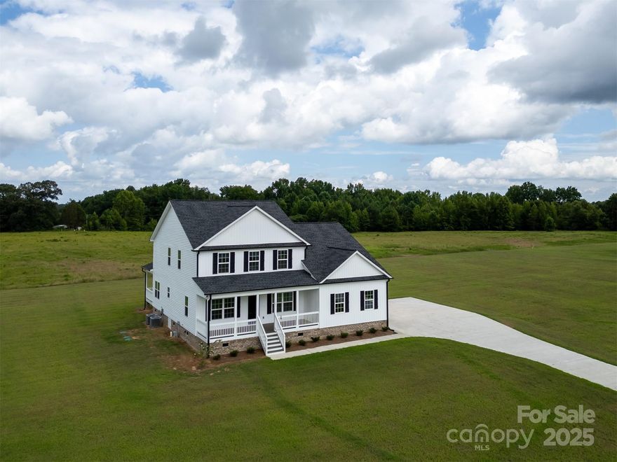 Not to far out, this new construction house comes with 4.16 acres of open cleared land. Step into this new home and you will love the open floor plan with large kitchen island. LVP flooring, Granite countertops  & shaker style cabinets. The main floor consists of a formal dining room, open kitchen great room area, primary bedroom with a large walk-in closet and laundry room Upstairs are 3 bedrooms, 2 baths and a loft/bonus area.
On the upstairs level there is a door leading to a huge walk-n attic area. This home also has a covered back porch.
Make this one your new home!
House  should be complete 2-28-2025.