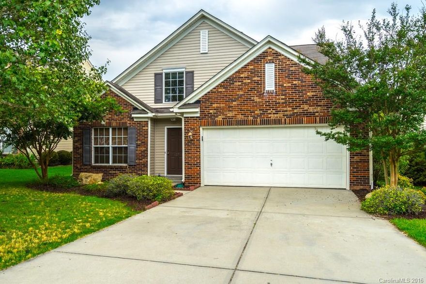 Check out this beautifully well maintained home in desireable Tega Cay! This spacious & open floorplan is sure to please with hardwood & tile floors on the main floor and brand new carpet upstairs.  Features include spacious master suite on main level, fireplace in great room and an awesome fenced backyard which backs up to common area. Great for entertaining.  Enjoy all the amenities that Tega Cay offers. You'll love it here.