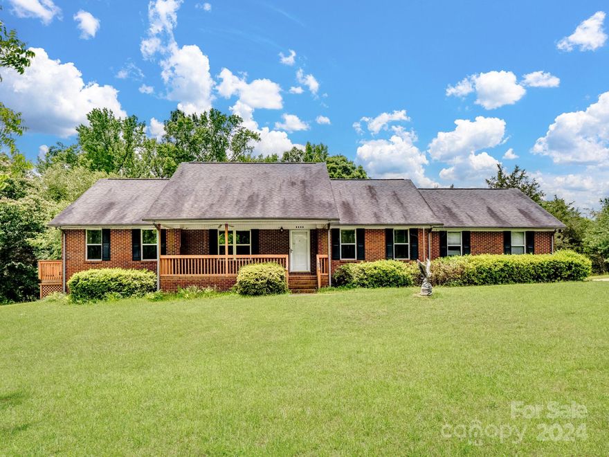 Nestled on over 10 acres, this property backs up to County land where the future Thistle Park will offer hiking trails, a dog park, a fishing area, and more. The land is equipped w/water spigots and numerous swings to enjoy the natural surroundings. An open barn, featuring a metal roof provides ample storage space or horses. The spacious sunroom offers a beautiful view of the woods, perfect for relaxation, while the deck is ideal for outdoor gatherings and enjoying the scenery. Roof is 10 yrs old. Inside, the vaulted living rm adds a sense of grandeur and openness, complemented by a cozy bay window at the breakfast bar. The property includes a convenient Jack and Jill bathroom, an oversized 2-car garage w/plenty of room for vehicles and storage, and a laundry rm featuring a utility sink and cabinets for additional storage. This property offers a unique blend of rustic charm and modern convenience, making it an ideal retreat for nature lovers and those seeking a peaceful lifestyle.