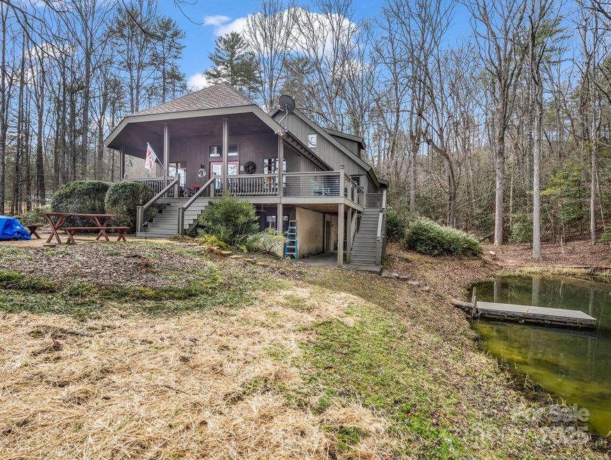 An absolute must see property! This Al Platt designed home is located a mile from downtown Brevard. The home sits on over 6.5 acres including hardwood trees, open pasture, and private pond. Living room has raised ceilings and lots of windows. South facing sunroom with brick floor and stone wall to gather heat, perfect for plants or morning coffee. Living room, dining room & office have hardwood floors. Living room also has designer propane wood stove  Kitchen has stone tile, granite countertops, upscale cabinets, and a large pantry. Main level primary bedroom has a large bath w/walk-in closet, and windows.  There are 3 bedrooms & 2 bathrooms upstairs. One of the bedrooms has a private bath and sitting room & deck. A lower level family room, is heated by wood stove.  There is also large basement area with shop, and lots of storage. On the property is  an original old farmhouse, very rustic, but does have electricity. It's use is open to the imagination. There is a whole house generator.