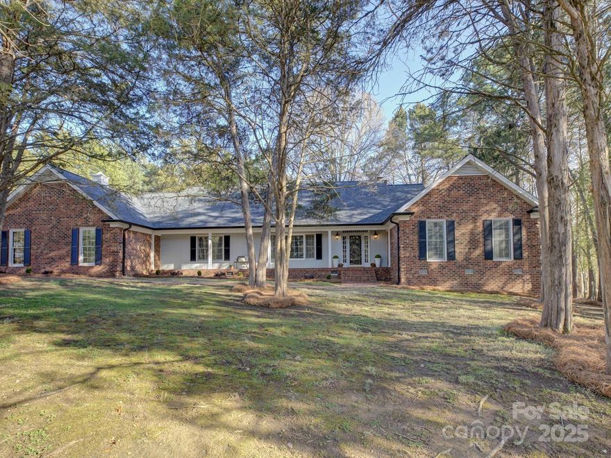 Amazing home and 1+ acre lot in one of South Charlotte's loveliest neighborhoods! Five Knolls Estates is close to all the conveniences of SouthPark, The Arboretum, Ballantyne, and I-485 with wide streets and beautiful presentation! This gorgeous 3700+ sf home is light, bright and spacious! Generously sized entertainment spaces and a glorious kitchen with an entertainer's island, cabinetry galore, and a beautiful view of the expansive, level back yard! The main level boasts the primary bedroom suite that connects to a 4th bedroom/study for wonderful flexibility, as well as a huge gameroom/flex space providing so much function! The wow factors continue upstairs with 2 secondary bedrooms with walk-in closets and SO MUCH attic walk-in storage space! The backyard possibilities are endless, but for now you can enjoy a private wooded retreat. Don't miss the attached storage room! This property is impressive! Fresh interior paint, newer roof, exterior paint, gutters, and tankless water heater!