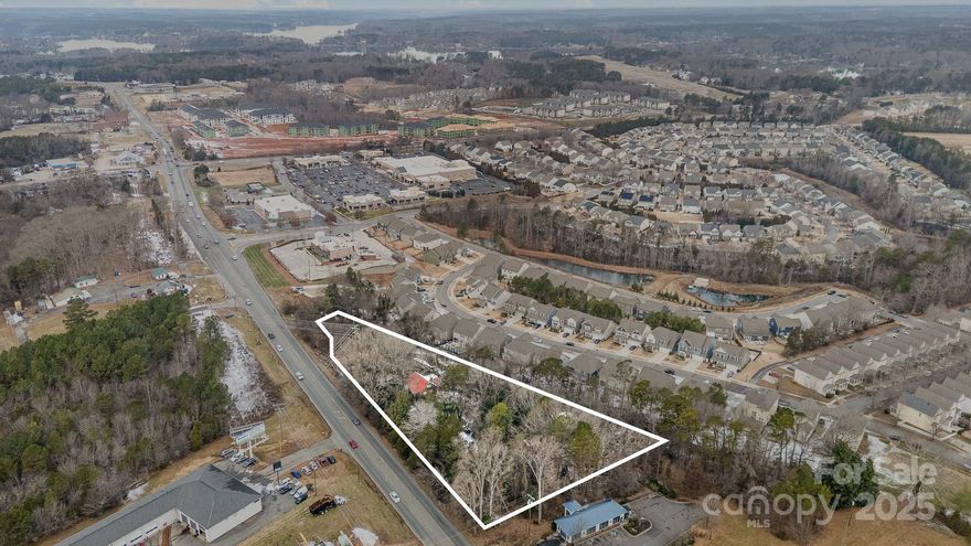 Prime property located in the bustling Lake Norman area offers exceptional opportunities for development. 
Road frontage is 486 ft and the traffic count, ranges from 28,000 to 37,000 vehicles per day. Guaranteed visibility for potential customers and clients.  Location is surrounded by retailers and this lot is perfectly positioned to attract businesses looking to capitalize on the Lake Norman area's continued growth and high consumer demand. Current zoning is RA with a potential commercial rezoning.  No value given to buildings.