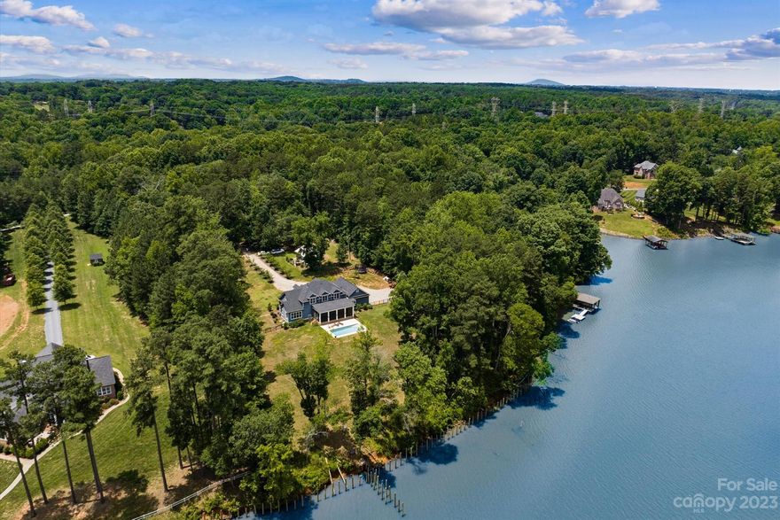Opportunities like this are very rare. This is a sale of 9 properties on Worthy Court all being sold together including the custom built lake front main house with 200' of water frontage, guest cottage, and 7 lots. This is an opportunity that you won't be able to find on the water in Belmont. Privacy awaits you in booming Belmont and on Lake Wylie.