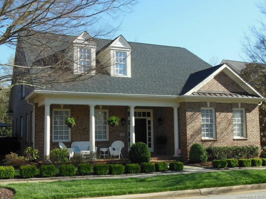 Custom built home-quality abounds! Relaxed feeling with large covered front porch overlooking the green & fountain. Open floor plan with wood floors throughout. Lovely sunroom overlooking private courtyard. Spacious main level master suite. Fireplace in great room can be enjoyed from kitchen with dining bar. Bose built-in speakers throughout to remain. 5-Zone irrigation.
