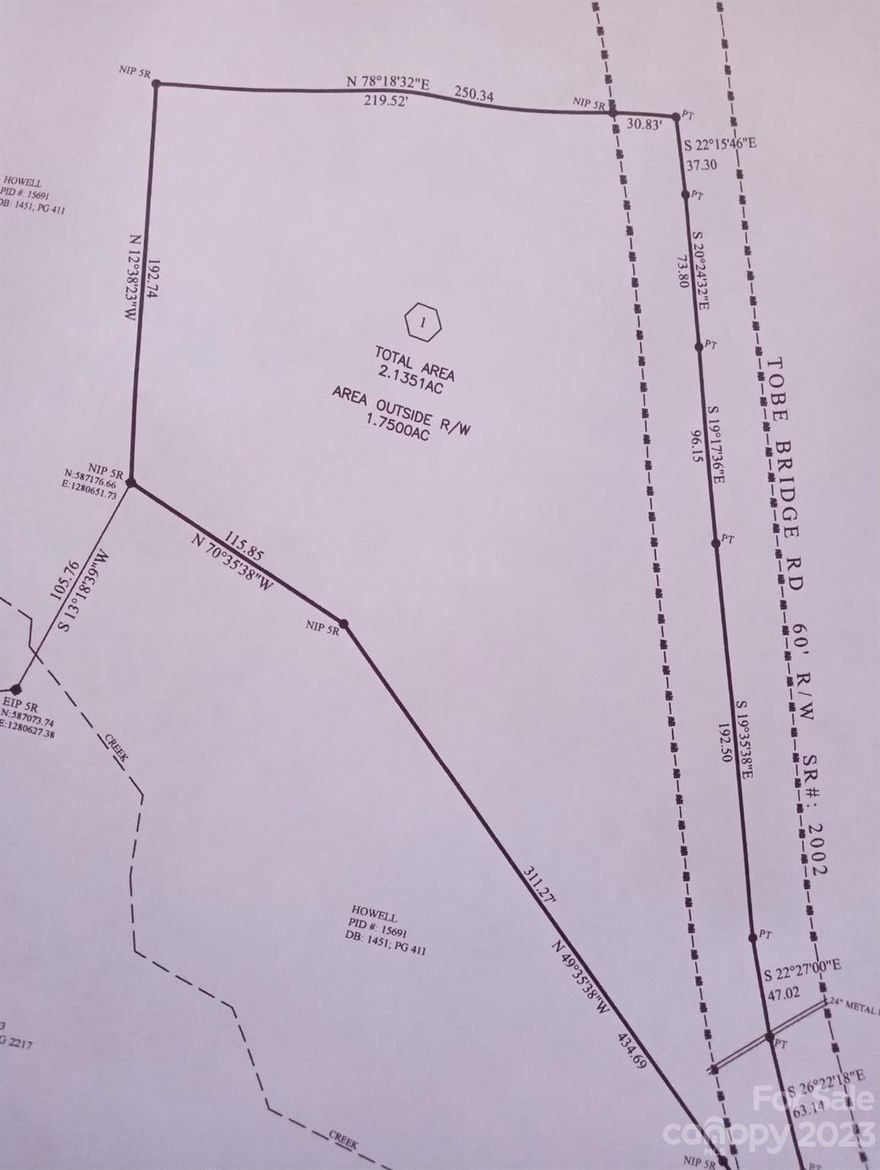 Approximately 2.1 acres. Survey attached in MLS. A small portion of parcel #15691. Mostly level, lightly wooded land. Tons of road frontage. This area has stick built, mobile homes and modular homes. Check with Cleveland County for uses. Survey stakes are up.