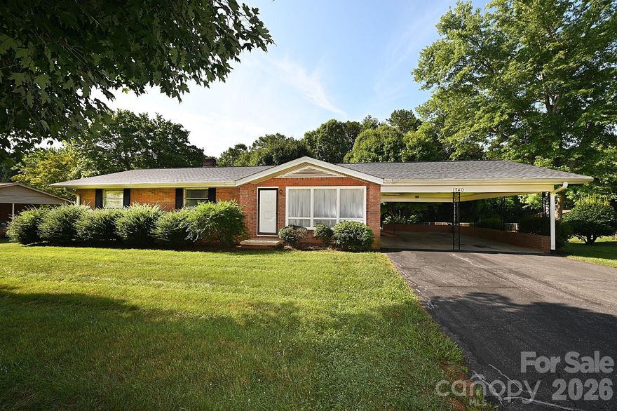 Nestled in a quiet neighborhood, this beautifully maintained home offers space, comfort, & room to grow! Step into the large living room, where a stunning picture window fills the space with natural light. The den/flex space opens seamlessly to the kitchen & dining area, featuring durable LVP flooring that extends down the hall. The spacious primary bedroom includes a private bath with a walk-in shower. 2 additional generously sized bedrooms share a full hall bath with a tub. You'll love the beautiful oak hardwood floors in the living room & bedrooms! Enjoy outdoor living on the concrete back porch overlooking a large backyard oasis perfect for relaxing, entertaining, gardening, & more. The full unfinished basement offers incredible potential to create additional living or entertaining space. A two-car carport & excellent curb appeal complete the package. Don’t miss your chance to see all this home has to offer—schedule your showing today!