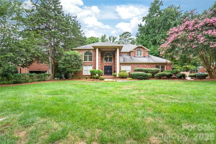 Stunning 5-bedroom, 3.5-bath custom-built full brick home showcasing elegant design and abundant natural light. Large windows fill the open layout with sunshine, while the impressive two-story foyer and dramatic double staircase create a grand entrance. The main-level guest suite with full bath offers comfort and flexibility for visitors. Enjoy a prime location - walk to Trader Joe’s, Starbucks, and 4 Mile Creek Greenway. Minutes to The Arboretum, Stonecrest, Ballantyne, SouthPark, with an easy commute to Uptown Charlotte. Set on a beautifully landscaped lot featuring a large rear deck, paver walkway, and fenced yard, this home combines timeless style with everyday convenience. Don’t miss the opportunity to make this exceptional property yours, schedule your showing today!