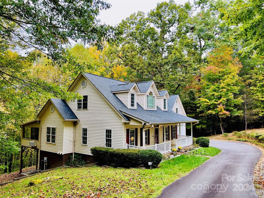 Hearthstone is a picturesque neighborhood located in the Horse Shoe community. 56 Kindling Trail offers a spacious 1.5 story home with several sought-after features that include a rocking chair front porch, primary suite on main, four-season room, finished room over garage and huge walk-out basement with recreation room, craft room, flex space and abundant storage. The wooded lot offers privacy and the opportunity to observe flora and fauna in their natural setting. Nearby attractions include the Pisgah National Forest, Ecusta Trail, Dupont State Forest and Jump Off Rock. Community favorites include The BARn, Cognative Brew House, Horse Shoe Farm, Briggs Garden Center, Etowah Valley Golf & Resort and several local restaurants.