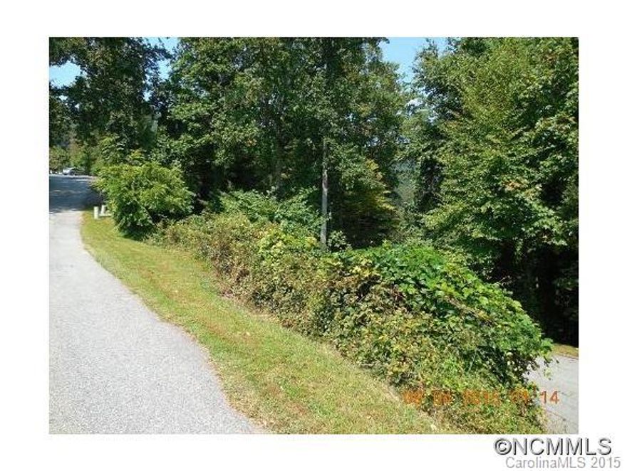 Located in the beautiful High Vista Falls gated community, this .34 acre lot is priced to sell.  19 hole golf course, clubhouse, and tennis are just a few of the amenities. Close to Hendersonville and Asheville. "As Is", bank addenda apply.