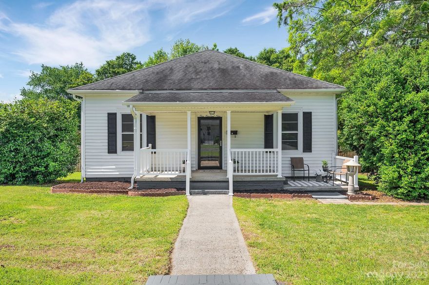 This old millhouse has had a refreshing update with some original character remaining! LVP flooring throughout the main living areas and new carpets in the bedrooms. The kitchen has new granite counter tops, hardwood cabinets and original built-in hutch. The backyard is gently sloped and fully fenced in with a large storage shed. NO HOA! Located within walking distance to restaurants, antique stores, and right around the corner from New Centre Park with a brand new playground and splash pad! Home is being sold as-is with no known defects.  Located within the highly sought after Clover School District. This would be a perfect opportunity for an investor to buy and hold! Agent is part owner.