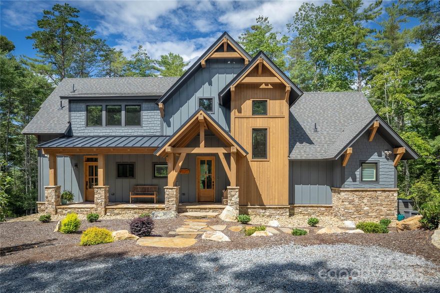 The journey is the destination at this Lake James retreat in the coveted 1780 community, where peace, privacy, and sweeping western mountain views await. A meandering, landscaped drive leads to welcoming outdoor spaces, natural plantings, and a hot tub for relaxing under the stars. Inside, rustic charm meets bright, open living with a spacious gathering area, chef’s kitchen, primary suite, and expansive decks on the main floor. Upstairs, you’ll find two bedrooms connected by a full Jack and Jill bathroom, perfect for family or guests. The lower level offers one additional bedroom, a comfortable lounge space, and an attached two-car garage. An oversized detached garage with a fully self-contained suite above adds exceptional flexibility for guests or extended stays. Deeded boat slip and Camp Lake James membership included. Boat slip is located off of Dragoon Demise Drive, Dock B Slip 10. Detached garage has one bedroom and 1 full bathroom as noted by 2nd Living Quarters in the Rooms description.