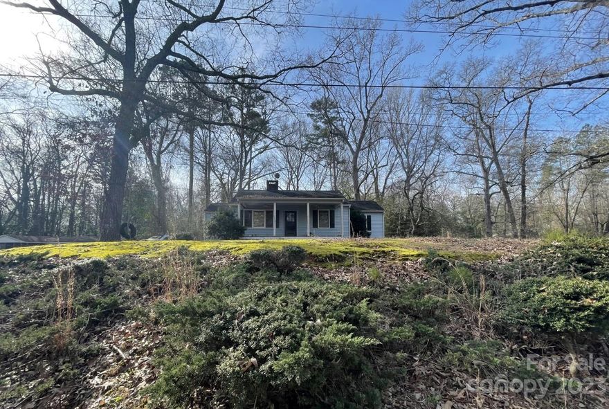 Don't miss out on this charming home on a corner lot. Home has a great front porch. There are multiple sheds for extra storage. The back deck can be accessed from the master suite. The home offers a fireplace in the living room.  Please be aware that the fireplace has not been turned on.