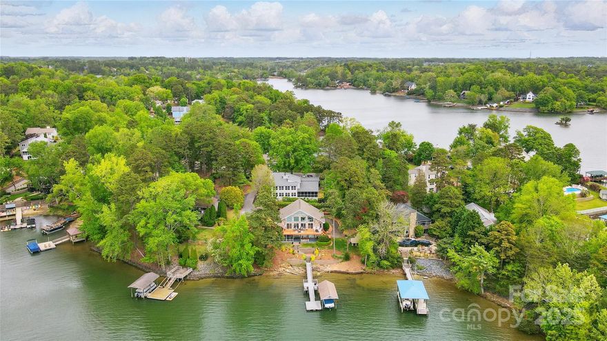 Welcome to your private lakeside oasis! This chalet-style retreat boasts a rare 145 feet of shoreline with Main Channel views. Nestled among the trees, this 3-bedroom, 3-bath home blends rustic charm with modern comfort.

Step inside to soaring ceilings, warm wood tones, and panoramic lake views. The spacious great room opens to an expansive front deck that spans the main floor—perfect for morning coffee or sunset cocktails. Downstairs, the walk-out basement offers both a screened porch and a covered patio, expanding your lakeside living even further.
Your waterfront experience is elevated with a deep water dock, covered boat lift, jet ski lift, floating dock, and stationary dock—ready for all your lake adventures.

Don’t miss your chance to own one of Tega Cay’s most unique and desirable waterfront properties.  This unique "stacked" lot gives amazing privacy with exceptional parking.  
Agent owned