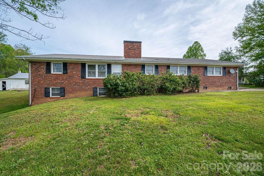 Opportunity awaits with this classic 1970s brick ranch nestled in the peaceful countryside! This 3-bedroom, 2-bath home offers solid bones and plenty of potential for the right buyer willing to bring their vision and updates.
Inside, you’ll find a traditional layout ready for renovation, along with a partial unfinished basement that provides additional storage or future expansion possibilities. The home also features an attached two-car garage for everyday convenience. Outside is where this property really shines—offering multiple outbuildings including a detached two-car garage, a block building perfect for a workshop or storage, and a metal carport shed for additional covered space. All of this sits on a generous ¾-acre lot with room to spread out and enjoy country living.
Whether you're an investor, handyman, or buyer looking to create your dream rural retreat, this property is full of potential and ready for its next chapter! Sold As-Is.  Neighboring 1930s home with well and power service, also on 3/4 acre lot also available! See MLS # 4366916