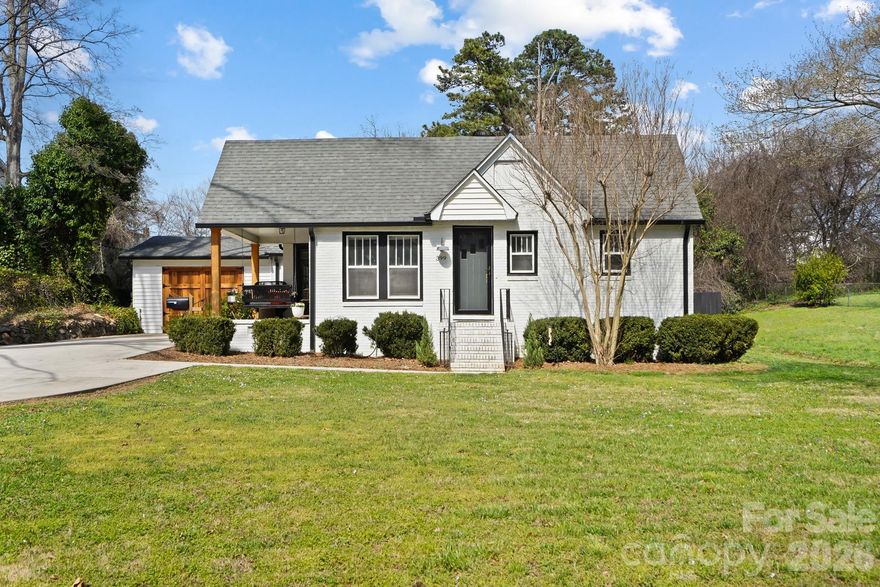 GORGEOUS CHARM AND CHARACTER of a 1930s home wrapped up with MODERN UPDATES and touches! MOVE-IN READY 3 bed/ 2 bath full-brick ranch with garage. This lovely home boasts beautiful '30s features such as restored original hardwoods, interior 5-panel doors and 15-lite glass doors, original glass doorknobs with working skeleton key locks (and yes, with the original keys!), restored beadboard ceilings, and RARE four-over-one windows. The square footage in this home has been very well utilized! A spacious and functional kitchen with all the modern trim, shaker cabinets with granite countertops, breakfast bar, and stainless appliances. A formal dining room fit for entertaining, complete with French doors. The primary suite is one to fall in love with! Plenty of space in this bedroom, stunning accent wall, private bathroom, and a large walk-in closet full of light. Added bonus: a rocking-chair porch right off the bedroom. Perfect to enjoy a cup of coffee in the morning or a good book. In this home you'll also find two more bedrooms and a 2nd bathroom. Step outside to a brand-new multi-level Trex deck and Gazebo. A delightful space to relax and wind down or gather and enjoy company. Fully fenced backyard includes a storage building. Don't miss the attached garage on this house! It's currently being used by the owners as a home gym, finished with custom barn doors that can be opened to let in fresh air. But could easily be used again as a regular oversized one-car garage. Key feature: the HEATED/COOLED FLEX SPACE behind the garage. Perfect for a craft room or art studio, home office, small workout room, or simply additional conditioned storage space.

Some other renovations to note-- electrical and all plumbing updated throughout, sealed crawlspace, spray foam insulation in attic.

Conveniently located in the heart of Kannapolis, just a short 0.7 miles from the newly revitalized Downtown Social District, Atrium Health Ballpark, the Gem Theatre, Village Park, and so many shopping and dining options. A prime location! ***Sellers offering Diamond Level HWA HOME WARRANTY.