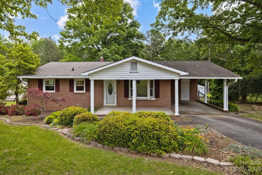 BUFORD COMMUNITY and SCHOOLS! This 2 bed 1 bath home is located on .55 acre lot with majestic oaks and mature landscaping. The kitchen and has ample storage and counter space and an eat-in area with access to the sizeable deck that overlooks the backyard that has wooded views and large storage building/workshop. The southern charm and character of this home makes it a perfect starter or investment. The sellers have chosen to sell the property AS_IS and are not interested in doing repairs.