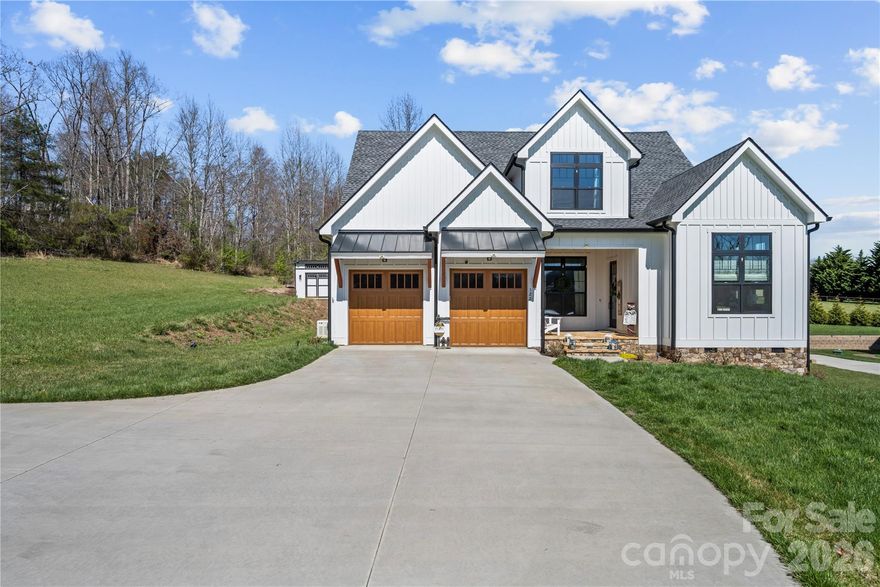 Welcome home to 122 Wintercress Drive sitting at the end of a quiet cul-de-sac in The Cottages at Wintercress, offering a private setting on a well-kept, level lot in Mills River.

Inside, the space is open while still feeling intentional and easy to live in. Vaulted ceilings bring in natural light, and the kitchen is centered around a large island that works just as well for everyday living as it does for hosting. The primary suite is on the main level and set apart for privacy, along with a dedicated office for work or quiet space. Upstairs, a finished bonus area adds flexibility beyond the 3-bedroom, 2.5-bath layout.

The outdoor living space stands out right away. The screened porch with a fireplace creates a space you’ll use year-round, whether it’s a quiet morning or a relaxed evening. The matching shed is great for storage, lawn care, equipment, or shop, complete with outdoor and indoor solar lights.

This location puts you right in the middle of Mills River’s most popular spots—approximately 10 minutes to Asheville Regional Airport, 7 minutes to Mills River Park, 5 minutes to Mills River Brewery, and 5 minutes to Bold Rock. Built in 2023 with hard board siding, Anderson exterior doors and windows, spray foam insulation, a full home generator, and an EV plug in the garage. With the thoughtful landscaping already in place, this is a home that’s been carefully finished and easy to step into from day one.