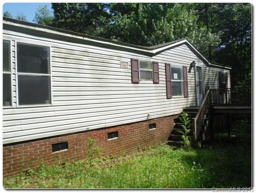 Great potential property on a large lot over 1 acre! Priced below assessed value. Property is located off of main road on private lot.